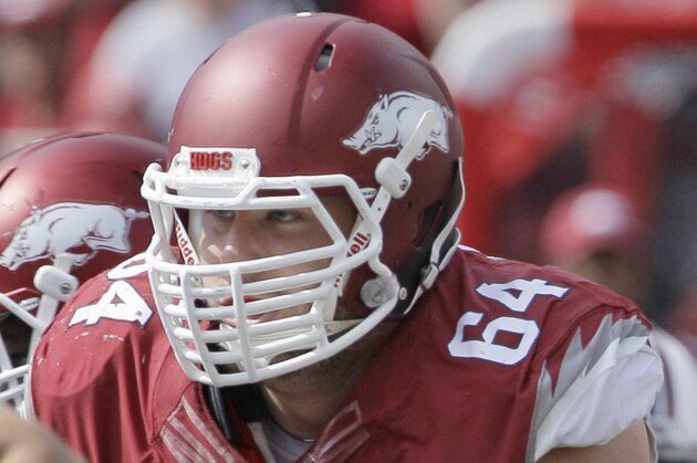 Arkansas center Travis Swanson plays during the second quarter of an NCAA college football game against South Carolina in Fayetteville, Ark., Saturday, Oct. 12, 2013. (AP Photo/Danny Johnston)