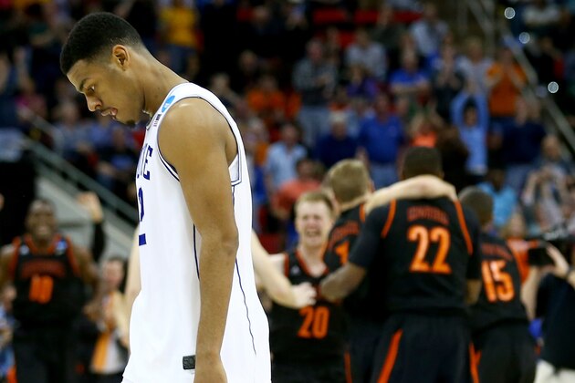 RALEIGH, NC - MARCH 21:  Quinn Cook #2 of the Duke Blue Devils walks off the court after losing to the Mercer Bears 78-71 in the second round of the 2014 NCAA Men's Basketball Tournament at PNC Arena on March 21, 2014 in Raleigh, North Carolina.  (Photo by Streeter Lecka/Getty Images)