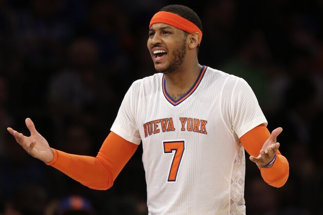 New York Knicks' Carmelo Anthony talks with New York Knicks' head coach Mike Woodson during the second half of the NBA basketball game against the Cleveland Cavaliers at Madison Square Garden, Sunday, March 23, 2014, in New York. The Cavaliers defeated the Knicks 106 to 100. (AP Photo/Seth Wenig)