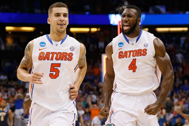 ORLANDO, FL - MARCH 22:  Scottie Wilbekin #5 and Patric Young #4 of the Florida Gators celebrate after Wilbekin makes a three-pointer to end the first half against the Pittsburgh Panthers during the third round of the 2014 NCAA Men's Basketball Tournament at Amway Center on March 22, 2014 in Orlando, Florida.  (Photo by Kevin C. Cox/Getty Images)