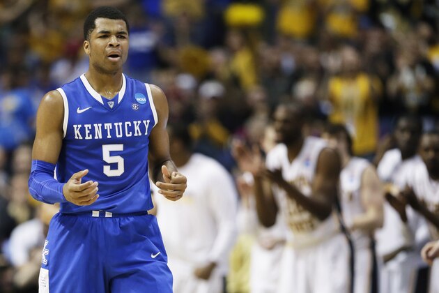 Kentucky guard Andrew Harrison (5) reacts against Wichita State during the first half of a third-round game of the NCAA college basketball tournament Sunday, March 23, 2014, in St. Louis. (AP Photo/Charlie Riedel)
