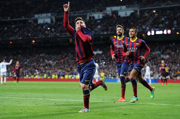 MADRID, SPAIN - MARCH 23:  Lionel Messi of Barcelona celebrates scoring his team's fourth goal during the La Liga match between Real Madrid CF and FC Barcelona at the Bernabeu on March 23, 2014 in Madrid, Spain.  (Photo by Denis Doyle/Getty Images)