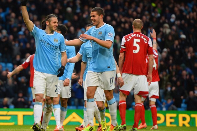 MANCHESTER, ENGLAND - MARCH 22:  Martin Demichelis of Manchester City celebrates scoring their fifth goal with Jack Rodwell of Manchester City  during the Barclays Premier League match between Manchester City and Fulham at Etihad Stadium on March 22, 2014 in Manchester, England.  (Photo by Michael Regan/Getty Images)
