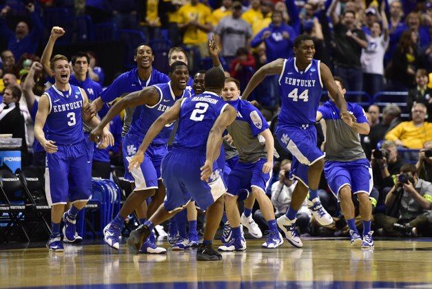 Mar 23, 2014; St. Louis, MO, USA; Kentucky Wildcats celebrate as the defeat the Wichita State Shockers 78-76  in the third round of the 2014 NCAA Men's Basketball Championship at Scottrade Center. Mandatory Credit: Scott Rovak-USA TODAY Sports