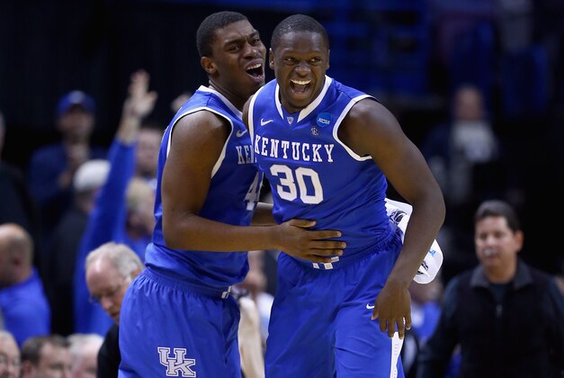 ST LOUIS, MO - MARCH 23: Julius Randle #30 of the Kentucky Wildcats celebrates with teammate Dakari Johnson #44 after defeating the Wichita State Shockers 78 to 76 during the third round of the 2014 NCAA Men's Basketball Tournament at Scottrade Center on March 23, 2014 in St Louis, Missouri.  (Photo by Andy Lyons/Getty Images)