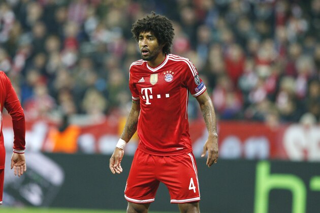 Bayern's Dante looks to his fellow players during the Champions League round of 16 second leg soccer match between FC Bayern Munich and FC Arsenal in Munich, Germany, Wednesday, March 12, 2014. (AP Photo/Matthias Schrader)