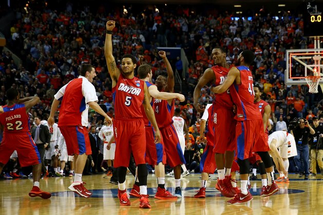 BUFFALO, NY - MARCH 22:  Devin Oliver #5 of the Dayton Flyers reacts after defeating the Syracuse Orange 55-53 in the third round of the 2014 NCAA Men's Basketball Tournament at the First Niagara Center on March 22, 2014 in Buffalo, New York.  (Photo by Elsa/Getty Images)