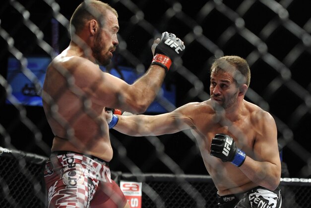May 15, 2012; Fairfax, VA, USA; Fabio Maldonado (right) returns a punch to Igor Pokrajac (left) during the Korean zombie vs Poirier event at Patriot Center.  Mandatory Credit: Rafael Suanes-USA TODAY Sports