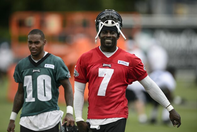 Jul 26, 2013; Philadelphia, PA, USA; Philadelphia Eagles quarterback Michael Vick (7) and wide receiver DeSean Jackson (10) walk off the field together at the end of practice during training camp at the Eagles NovaCare Complex. Mandatory Credit: Howard Smith-USA TODAY Sports