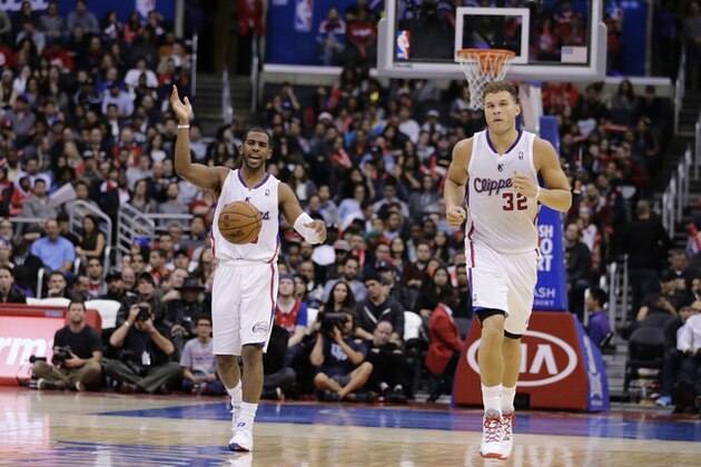 Los Angeles Clippers' Chris Paul, left, and Los Angeles Clippers' Blake Griffin make their way down the court during the second half of an NBA basketball game against the New Orleans Pelicans on Wednesday, Dec. 18, 2013, in Los Angeles. The Clippers won 108-95. (AP Photo/Jae C. Hong)