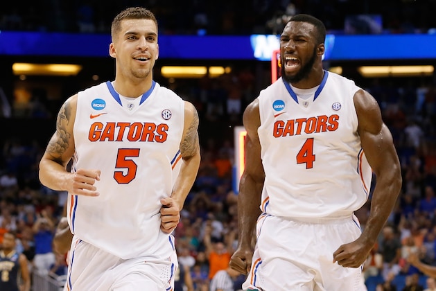 ORLANDO, FL - MARCH 22: Scottie Wilbekin #5 and Patric Young #4 of the Florida Gators celebrate after Wilbekin makes a three-pointer to end the first half against the Pittsburgh Panthers during the third round of the 2014 NCAA Men's Basketball Tournament at Amway Center on March 22, 2014 in Orlando, Florida. (Photo by Kevin C. Cox/Getty Images) ORLANDO, FL - MARCH 22: Scottie Wilbekin #5 and Patric Young #4 of the Florida Gators celebrate after Wilbekin makes a three-pointer to end the first half against the Pittsburgh Panthers during the third round of the 2014 NCAA Men's Basketball Tournament at Amway Center on March 22, 2014 in Orlando, Florida. (Photo by Kevin C. Cox/Getty Images)