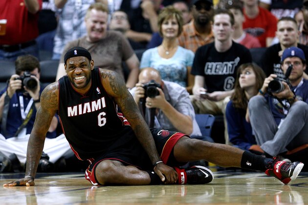 Miami Heat forward LeBron James reacts after falling to the ground during the second half of an NBA basketball game against the New Orleans Pelicans in New Orleans, Saturday, March 22, 2014. The Pelicans won 105-95. (AP Photo/Jonathan Bachman)