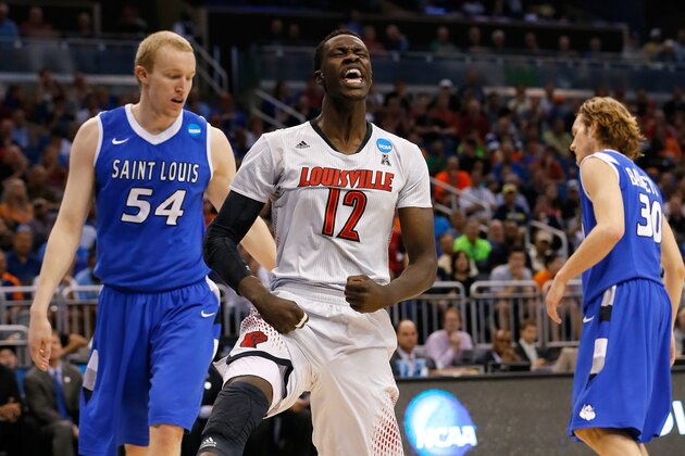 ORLANDO, FL - MARCH 22:  Mangok Mathiang #12 of the Louisville Cardinals reacts in the first half after dunking the ball against the Saint Louis Billikens during the third round of the 2014 NCAA Men's Basketball Tournament at Amway Center on March 22, 2014 in Orlando, Florida.  (Photo by Kevin C. Cox/Getty Images)