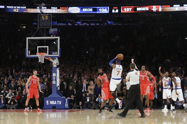 New York Knicks' Carmelo Anthony (7) shoots over Houston Rockets' James Harden (13) during the second half of an NBA basketball game Thursday, Nov. 14, 2013, in New York. The Rockets won 109-106. Harden fouled Anthony on the play. (AP Photo/Frank Franklin II)