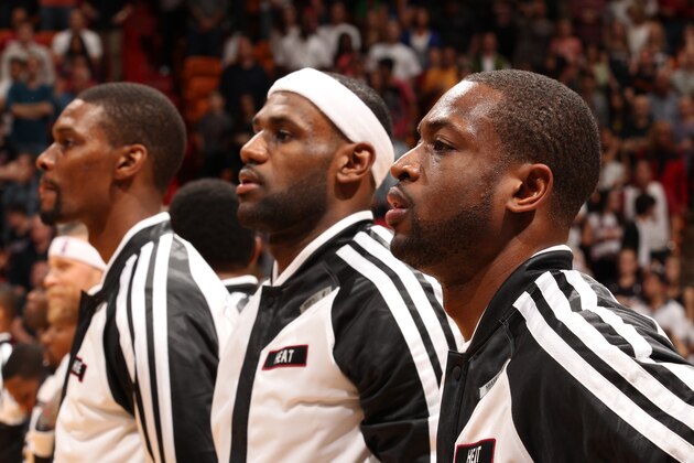 MIAMI, FL - JANUARY 2: Dwyane Wade #3, LeBron James #6, and Chris Bosh #1 of the Miami Heat stand during the national anthem before the game against the Golden State Warriors at the American Airlines Arena in Miami, Florida on Jan. 23, 2014. NOTE TO USER: User expressly acknowledges and agrees that, by downloading and/or using this photograph, user is consenting to the terms and conditions of the Getty Images License Agreement. Mandatory copyright notice: Copyright NBAE 2014 (Photo by Issac Baldizon/NBAE via Getty Images)