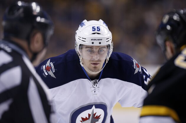 Winnipeg Jets' Mark Scheifele (55) waits for a face off in the third period of an NHL hockey game against the Boston Bruins in Boston, Saturday, Jan. 4, 2014. The Bruins won 4-1. (AP Photo/Michael Dwyer)