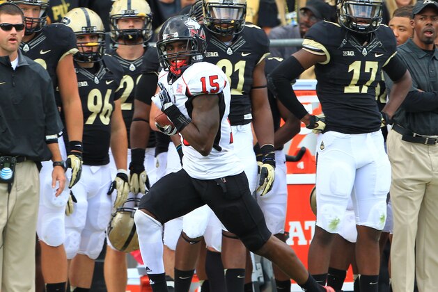 Sep 28, 2013; West Lafayette, IN, USA; Northern Illinois Huskies safety Jimmie Ward (15) returns an interception for a touchdown against the Purdue Boilermakers at Ross Ade Stadium. Northern Illinois won 55-24. Mandatory Credit: Pat Lovell-USA TODAY Sports