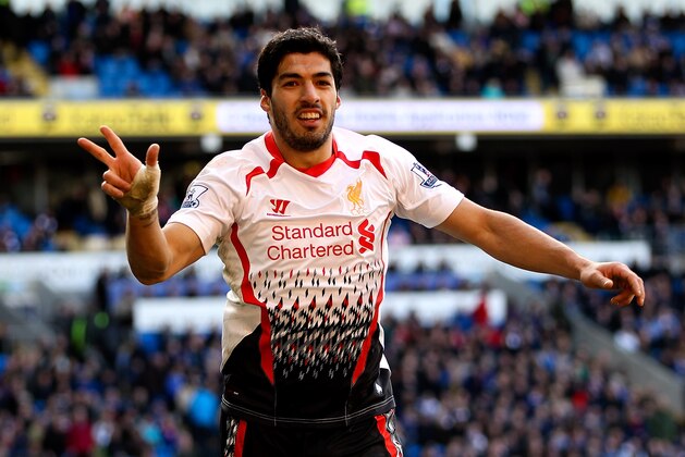 CARDIFF, WALES - MARCH 22:  Luis Suarez of Liverpool celebrates after scoring hihs third and his team's sixth goal of the game during the Barclays Premier League match between Cardiff City and Liverpool at Cardiff City Stadium on March 22, 2014 in Cardiff, Wales.  (Photo by Ben Hoskins/Getty Images)