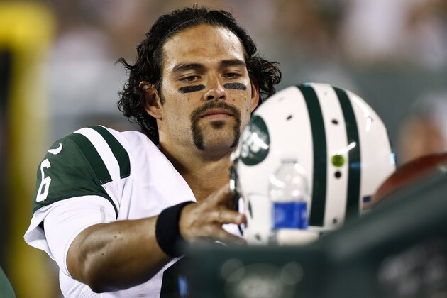 EAST RUTHERFORD, NJ - AUGUST 17:   Mark Sanchez #6 of the New York Jets puts his hemet on the bench during their preseason game against the Jacksonville Jaguars at MetLife Stadium on August 17, 2013 in East Rutherford, New Jersey.  (Photo by Jeff Zelevansky/Getty Images)