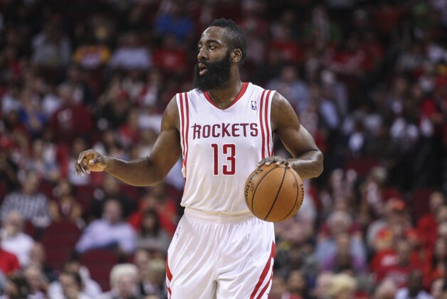 Oct 30, 2013; Houston, TX, USA; Houston Rockets shooting guard James Harden (13) controls the ball during the first quarter against the Charlotte Bobcats at Toyota Center. Mandatory Credit: Troy Taormina-USA TODAY Sports