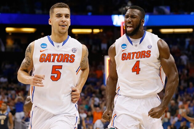 ORLANDO, FL - MARCH 22:  Scottie Wilbekin #5 and Patric Young #4 of the Florida Gators celebrate after Wilbekin makes a three-pointer to end the first half against the Pittsburgh Panthers during the third round of the 2014 NCAA Men's Basketball Tournament at Amway Center on March 22, 2014 in Orlando, Florida.  (Photo by Kevin C. Cox/Getty Images)