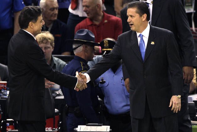 Louisville head coach Rick Pitino, left, shakes hands with Kentucky head coach John Calipari before the first half of an NCAA Final Four semifinal college basketball tournament game Saturday, March 31, 2012, in New Orleans. (AP Photo/Bill Haber)