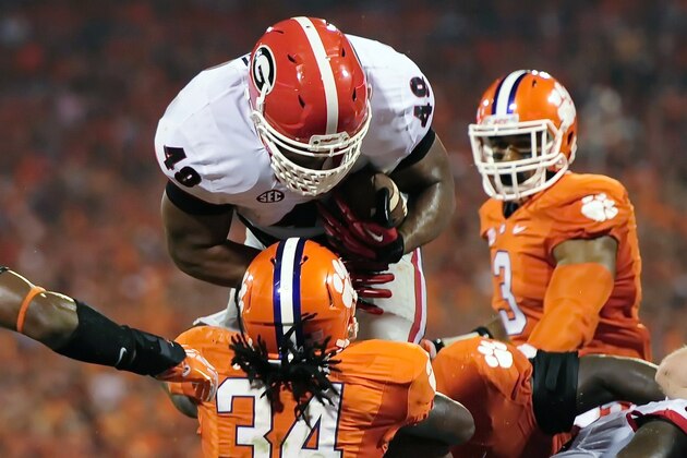 Georgia fullback Quayvon Hicks is stopped at the goal line by Clemson's Quandon Christian during the second half of an NCAA college football game, Saturday, Aug. 31, 2013, at Memorial Stadium in Clemson, S.C. (AP Photo/ Richard Shiro)
