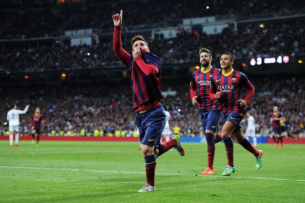 MADRID, SPAIN - MARCH 23:  Lionel Messi of Barcelona celebrates scoring his team's fourth goal during the La Liga match between Real Madrid CF and FC Barcelona at the Bernabeu on March 23, 2014 in Madrid, Spain.  (Photo by Denis Doyle/Getty Images)