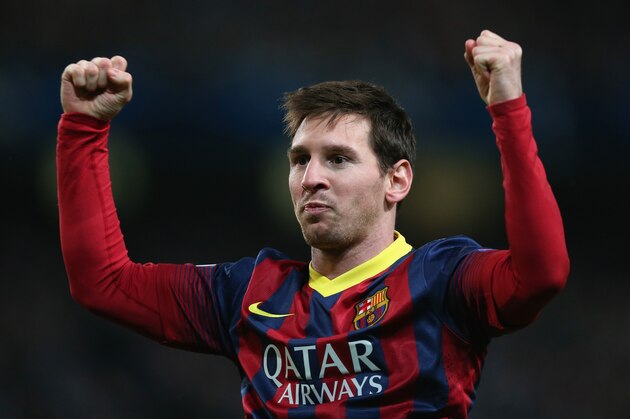 MANCHESTER, ENGLAND - FEBRUARY 18:  Lionel Messi of Barcelona celebrates scoring the opening goal from a penalty kick during the UEFA Champions League Round of 16 first leg match between Manchester City and Barcelona at the Etihad Stadium on February 18, 2014 in Manchester, England.  (Photo by Clive Brunskill/Getty Images)