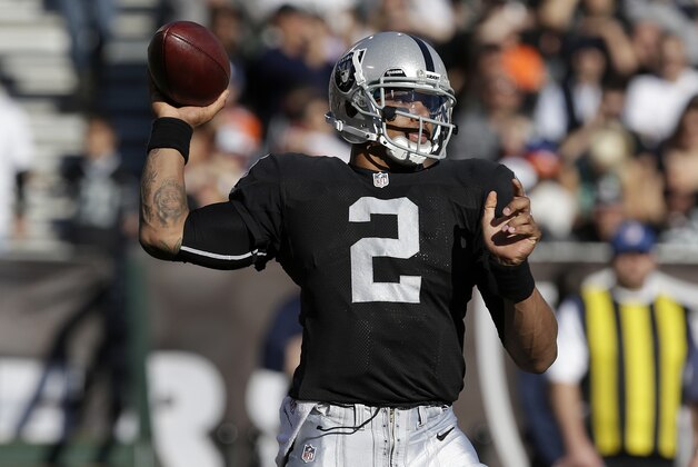 Oakland Raiders quarterback Terrelle Pryor (2) against the Denver Broncos during an NFL football game in Oakland, Calif., Sunday, Dec. 29, 2013. (AP Photo/Tony Avelar)