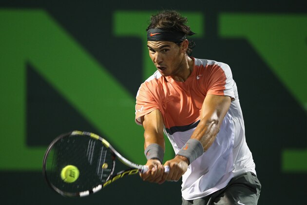 KEY BISCAYNE, FL - MARCH 22:  Rafael Nadal of Spain plays a backhand against Lleyton Hewitt of Australia during their second round match during day 6 at the Sony Open at Crandon Park Tennis Center on March 22, 2014 in Key Biscayne, Florida.  (Photo by Clive Brunskill/Getty Images)