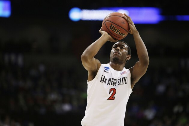 San Diego State’s Xavier Thames (2) takes a free throw during the second-round game of the NCAA men's college basketball tournament against New Mexico State, in Spokane, Wash., Thursday, March 20, 2014. (AP Photo/Young Kwak)
