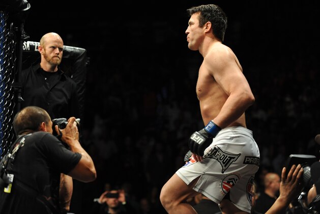 Nov 16, 2013; Las Vegas, NV, USA; Chael Sonnen (blue gloves) walks towards the cage before his light heavyweight bout during UFC 167 at MGM Grand Garden Arena. Mandatory Credit: Stephen R. Sylvanie-USA TODAY Sports