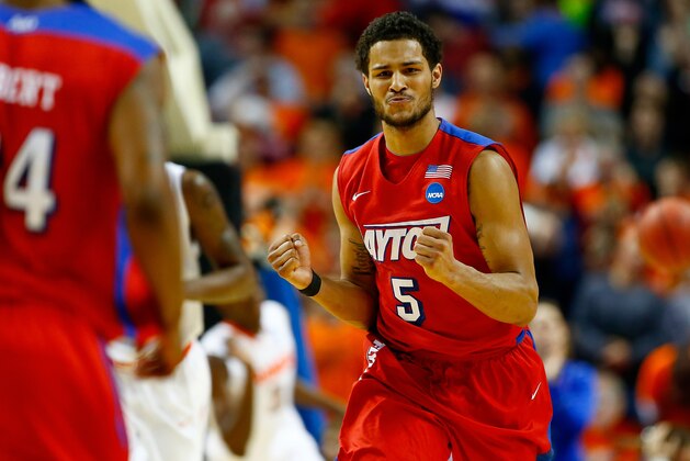 BUFFALO, NY - MARCH 22: Devin Oliver #5 of the Dayton Flyers celebrates against the Syracuse Orange during the third round of the 2014 NCAA Men's Basketball Tournament at the First Niagara Center on March 22, 2014 in Buffalo, New York.  (Photo by Jared Wickerham/Getty Images)