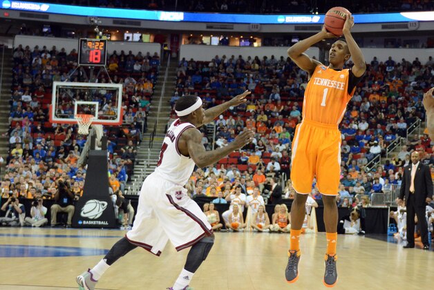 Mar 21, 2014; Raleigh, NC, USA; Tennessee Volunteers guard Josh Richardson (1) shoots the ball against Massachusetts Minutemen guard Chaz Williams (3) in the first half of a men's college basketball game during the second round of the 2014 NCAA Tournament at PNC Arena. Mandatory Credit: Rob Kinnan-USA TODAY Sports