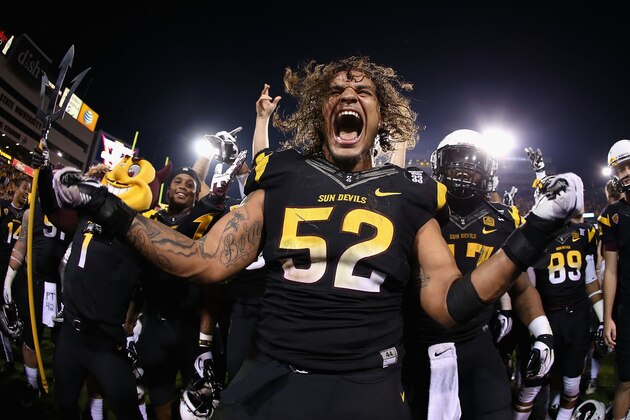 TEMPE, AZ - NOVEMBER 30:  Linebacker Carl Bradford #52 of the Arizona State Sun Devils celebrates after defeating the Arizona Wildcats 58-21 in the college football game at Sun Devil Stadium on November 30, 2013 in Tempe, Arizona.  (Photo by Christian Petersen/Getty Images)