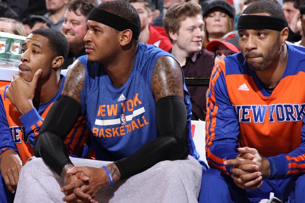 PORTLAND, OR - NOVEMBER 25: Carmelo Anthony #7 of the New York Knicks sits on the bench against the Portland Trail Blazers on November 25, 2013 at the Moda Center Arena in Portland, Oregon. NOTE TO USER: User expressly acknowledges and agrees that, by downloading and or using this photograph, user is consenting to the terms and conditions of the Getty Images License Agreement. Mandatory Copyright Notice: Copyright 2013 NBAE (Photo by Sam Forencich/NBAE via Getty Images) PORTLAND, OR - NOVEMBER 25: Carmelo Anthony #7 of the New York Knicks sits on the bench against the Portland Trail Blazers on November 25, 2013 at the Moda Center Arena in Portland, Oregon. NOTE TO USER: User expressly acknowledges and agrees that, by downloading and or using this photograph, user is consenting to the terms and conditions of the Getty Images License Agreement. Mandatory Copyright Notice: Copyright 2013 NBAE (Photo by Sam Forencich/NBAE via Getty Images)