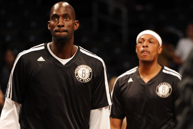 Oct 12, 2013; Brooklyn, NY, USA; Brooklyn Nets power forward Kevin Garnett (left) and Brooklyn Nets small forward Paul Pierce look on before the first half of the preseason game against the Detroit Pistons at Barclays Center. Mandatory Credit: Joe Camporeale-USA TODAY Sports