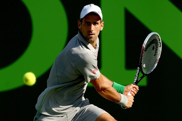KEY BISCAYNE, FL - MARCH 21:  Novak Djokovic of Serbia returns a shot to Jeremy Chardy of France during the Sony Open at the Crandon Park Tennis Center on March 21, 2014 in Key Biscayne, Florida.  (Photo by Matthew Stockman/Getty Images)