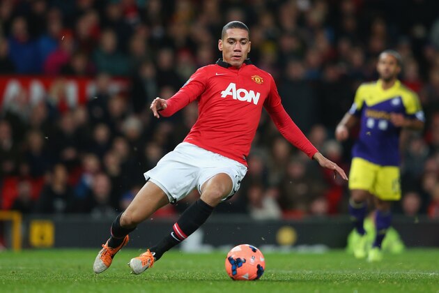 MANCHESTER, ENGLAND - JANUARY 05:  Chris Smalling of Manchester United in action during the FA Cup with Budweiser Third round match between Manchester United and Swansea City at Old Trafford on January 5, 2014 in Manchester, England.  (Photo by Alex Livesey/Getty Images)