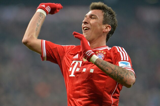 Bayern's Mario Mandzukic of Croatia celebrates after scoring, during the German first division Bundesliga soccer match between  FC Bayern Munich and FC Schalke in Munich, Germany, on Saturday, March 1,  2014. (AP Photo/Kerstin Joensson)