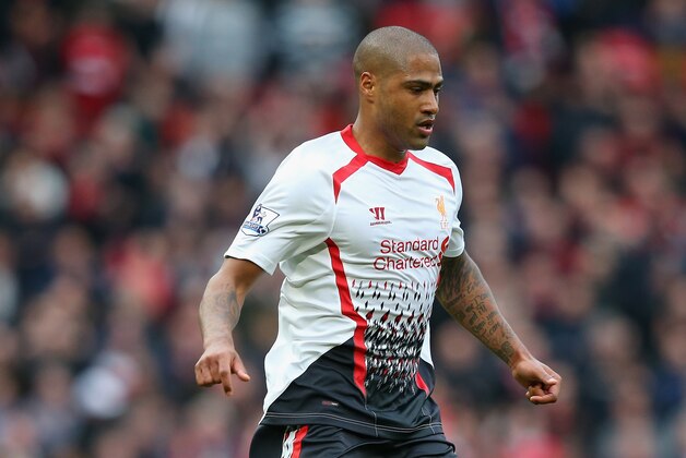 MANCHESTER, ENGLAND - MARCH 16:  Glen Johnson of Liverpool in action during the Barclays Premier League match between Manchester United and Liverpool at Old Trafford on March 16, 2014 in Manchester, England.  (Photo by Alex Livesey/Getty Images)