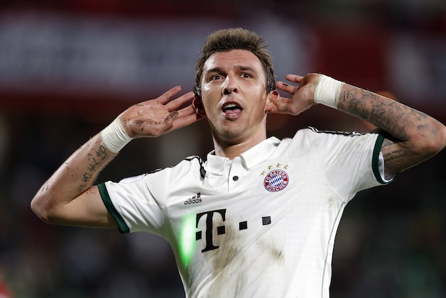 Bayern's Mario Mandzukic celebrates after scoring a goal during the semi final soccer match between Guangzhou Evergrande and Bayern Munich at the Club World Cup soccer tournament in Agadir, Morocco, Tuesday, Dec. 17, 2013. (AP Photo/Christophe Ena)