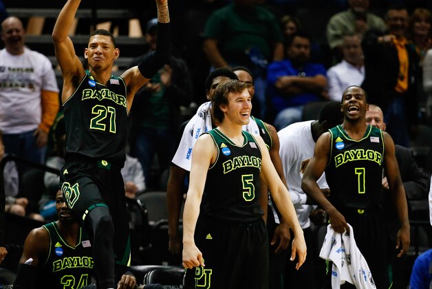 Mar 23, 2014; San Antonio, TX, USA; Baylor Bears center Isaiah Austin (21) and guard Brady Heslip (5) and guard Kenny Chery (1) celebrate after they beat the Creighton Bluejays in a men's college basketball game during the third round of the 2014 NCAA Tournament at AT&T Center. Mandatory Credit: Kevin Jairaj-USA TODAY Sports