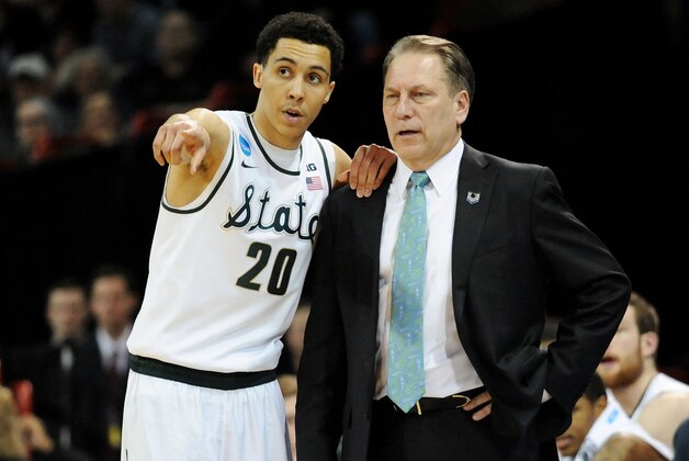 SPOKANE, WA - MARCH 22:  Head coach Tom Izzo and Travis Trice #20 of the Michigan State Spartans talk in the second half against the Harvard Crimson during the Third Round of the 2014 NCAA Basketball Tournament at Spokane Veterans Memorial Arena on March 22, 2014 in Spokane, Washington.  (Photo by Steve Dykes/Getty Images)
