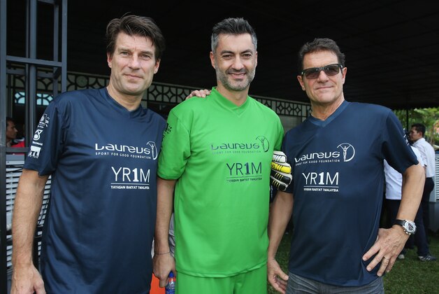 KUALA LUMPUR, MALAYSIA - MARCH 25: (L-R) Michael Laudrup, Vitor Baia and Fabio Capello look on during the Laureus All Stars Unity Cup ahead of the 2014 Laureus World Sports Awards at Royal Selangor Club on March 25, 2014 in Kuala Lumpur, Malaysia. (Photo by Ian Walton/Getty Images for Laureus) KUALA LUMPUR, MALAYSIA - MARCH 25: (L-R) Michael Laudrup, Vitor Baia and Fabio Capello look on during the Laureus All Stars Unity Cup ahead of the 2014 Laureus World Sports Awards at Royal Selangor Club on March 25, 2014 in Kuala Lumpur, Malaysia. (Photo by Ian Walton/Getty Images for Laureus)