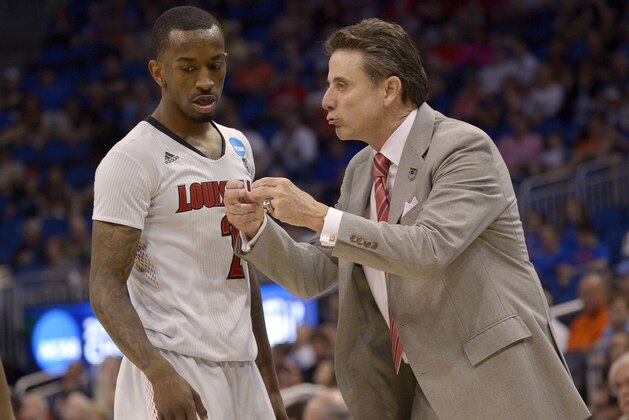 Louisville coach Rick Pitino yells at Louisville guard Russ Smith (2) during the second half in a third-round game in the NCAA college basketball tournament against Saint Louis,  Saturday, March 22, 2014, in Orlando, Fla. (AP Photo/Phelan M. Ebenhack)