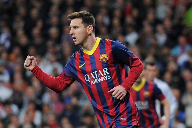MADRID, SPAIN - MARCH 23:  Lionel Messi of Barcelona celebrates scoring his team's third goal during the La Liga match between Real Madrid CF and FC Barcelona at the Bernabeu on March 23, 2014 in Madrid, Spain.  (Photo by Denis Doyle/Getty Images)