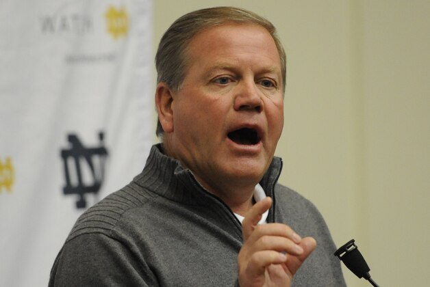 Notre Dame football coach Brian Kelly talks to the media as spring football practice begins Friday, Feb. 28, 2014 in South Bend, Ind. (AP Photo/Joe Raymond)
