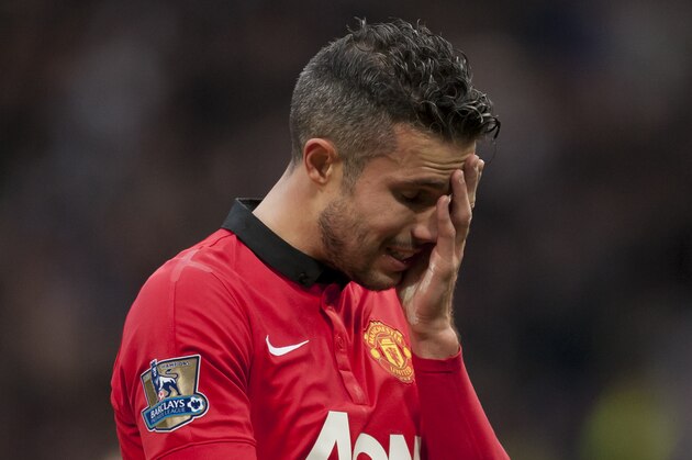 Manchester United's Robin van Persie wipes his face as he walks from the pitch after his team's 1-0 defeat to Newcastle in their English Premier League soccer match at Old Trafford Stadium, Manchester, England, Saturday Dec. 7, 2013. (AP Photo/Jon Super) Manchester United's Robin van Persie wipes his face as he walks from the pitch after his team's 1-0 defeat to Newcastle in their English Premier League soccer match at Old Trafford Stadium, Manchester, England, Saturday Dec. 7, 2013. (AP Photo/Jon Super)